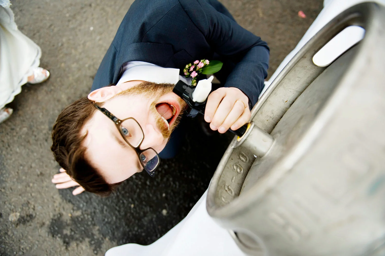 Groom drinking from a Keg Hilden Brewery Antrim Ireland Wedding Photography