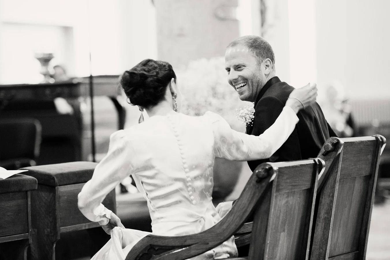 groom laughing in church sandymount Ireland Wedding Photography Irish wedding photographers
