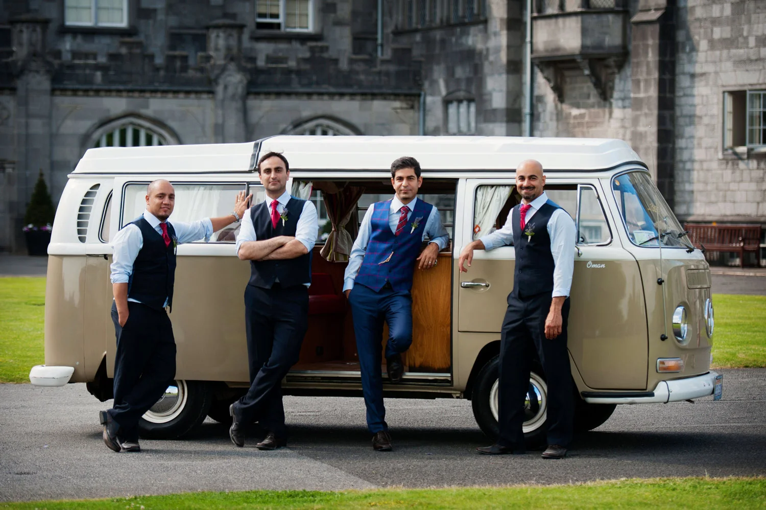 Groomsmen stand outside vinatge VW van Kilkenny Castle Ireland Wedding Photography