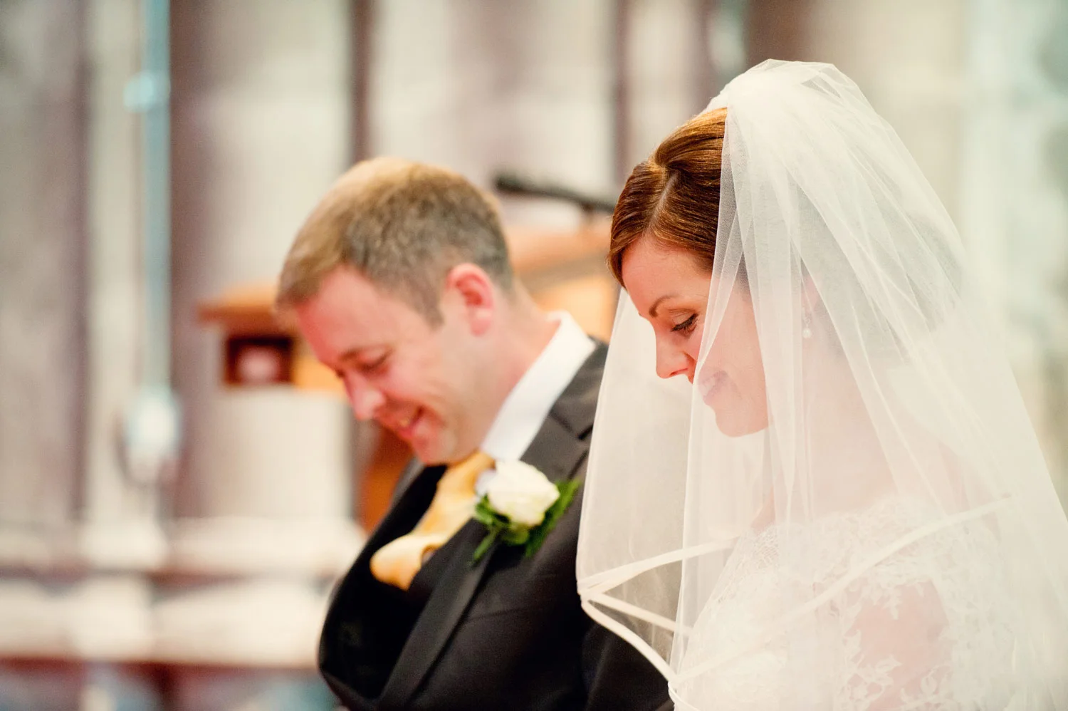 bride and groom kilkenny cathedral close up laughing Ireland Wedding Photography Irish wedding photographers
