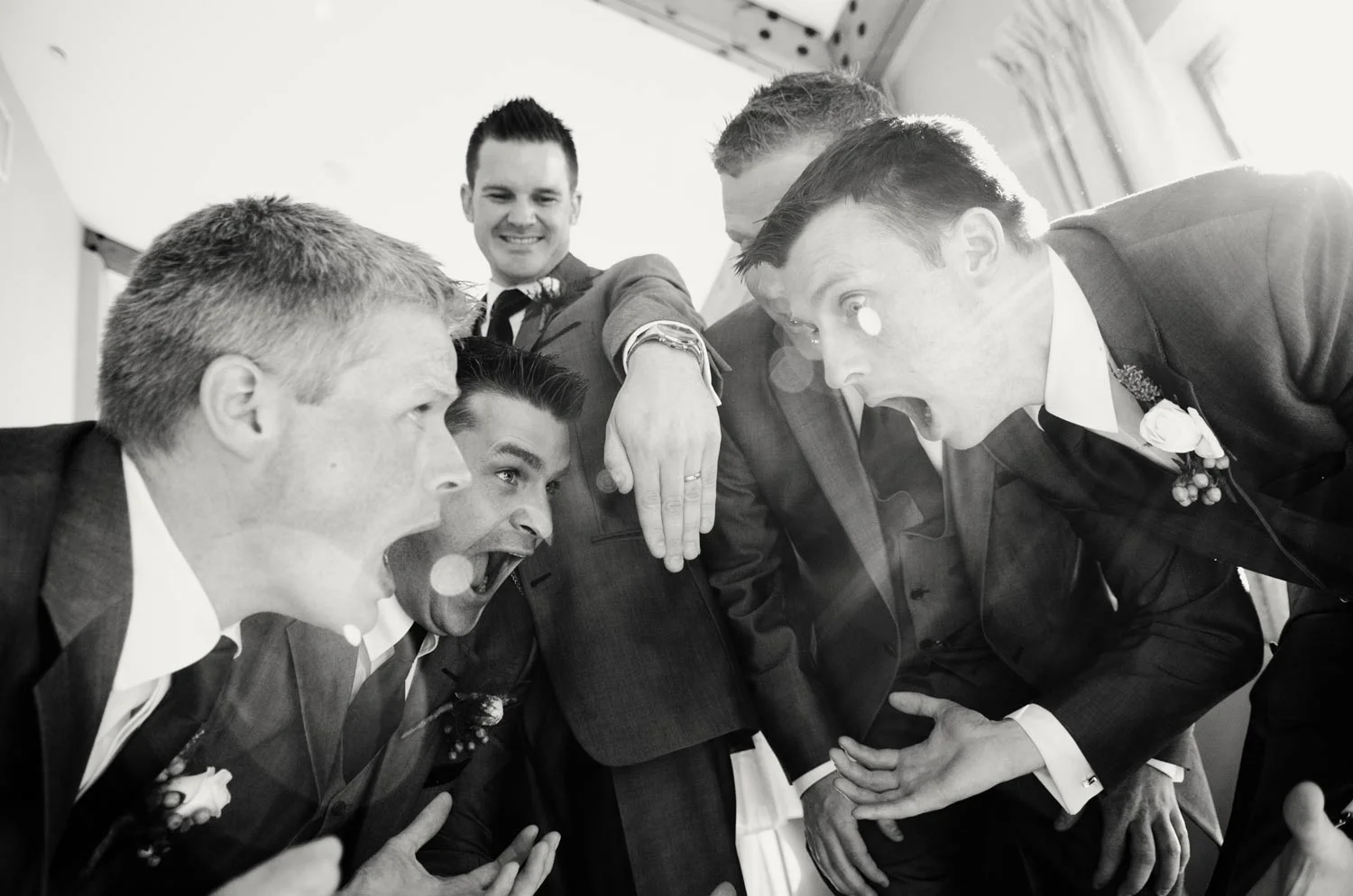 Groomsmen in shock at wedding ring on groom Druids Glen Wicklow Ireland Wedding Photography