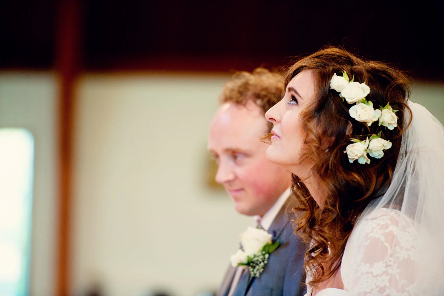 bride looking up in church monaghan Ireland Wedding Photography Irish wedding photographers