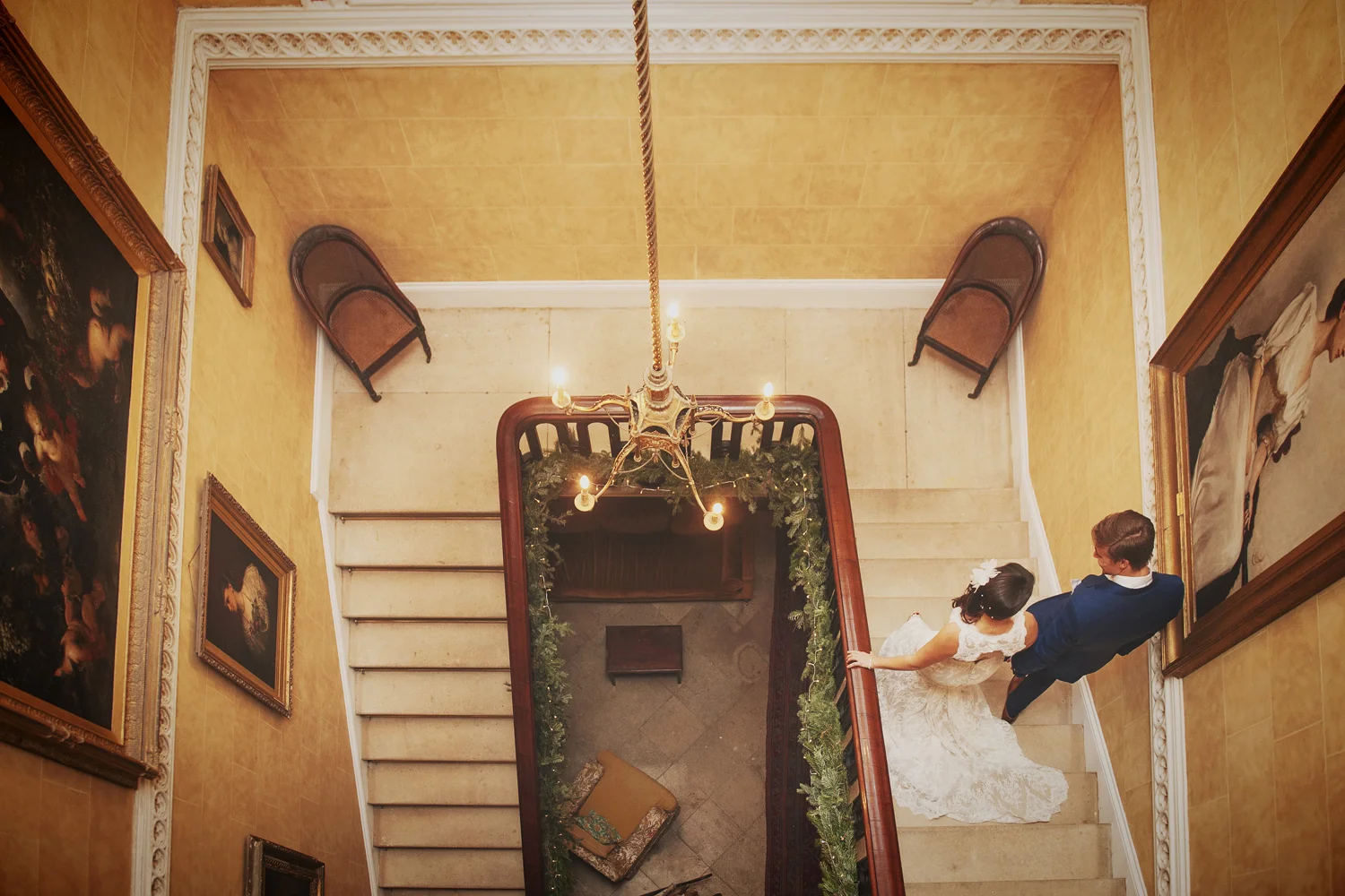 Bride and groom walking down stairs in Borris House Carlow