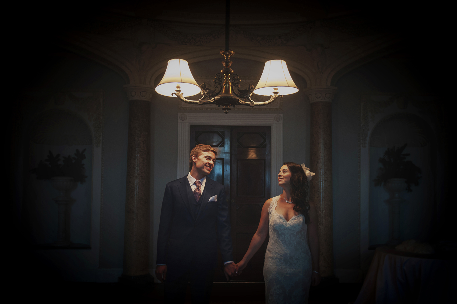 Couple standing under a light in Borris House Carlow wedding photographers ireland