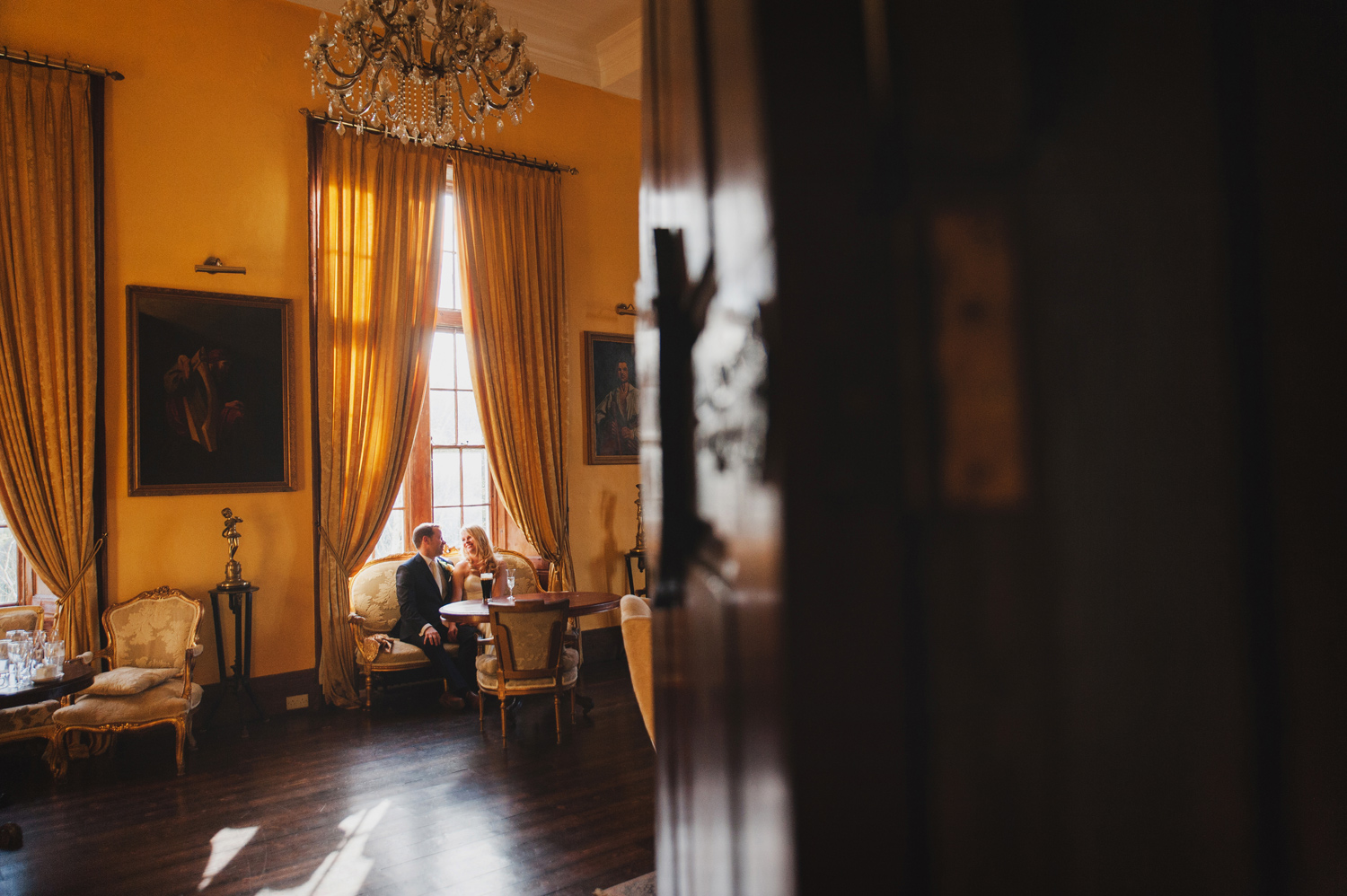Couple enjoying a quiet moment in Kinnitty Castle Offaly Ireland. Wedding Photographers