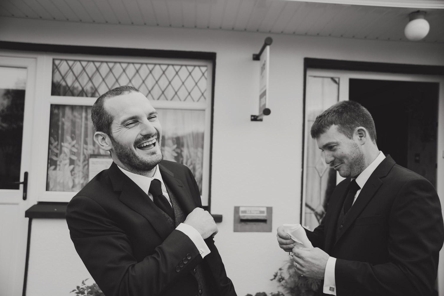 Groom and brother laughing on the morning of the wedding. Wedding photography meath