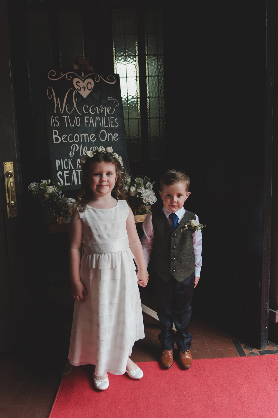 Flower girl and page boy at church entrance at Wedding in Monaghan