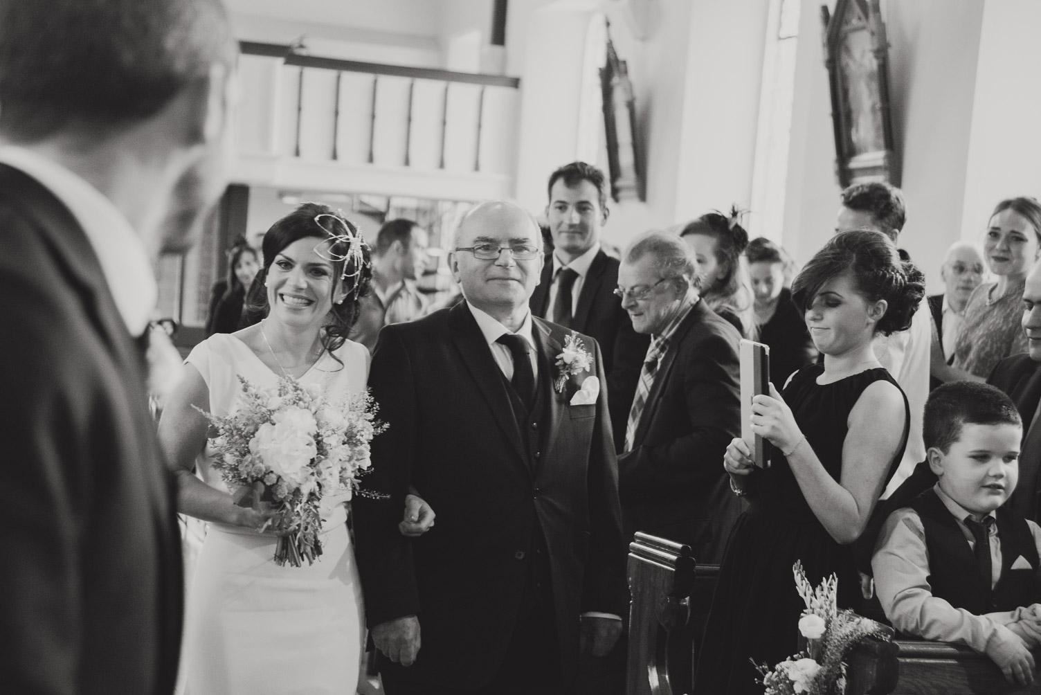 Bride walking up the aisle in church. Wedding photography meath.