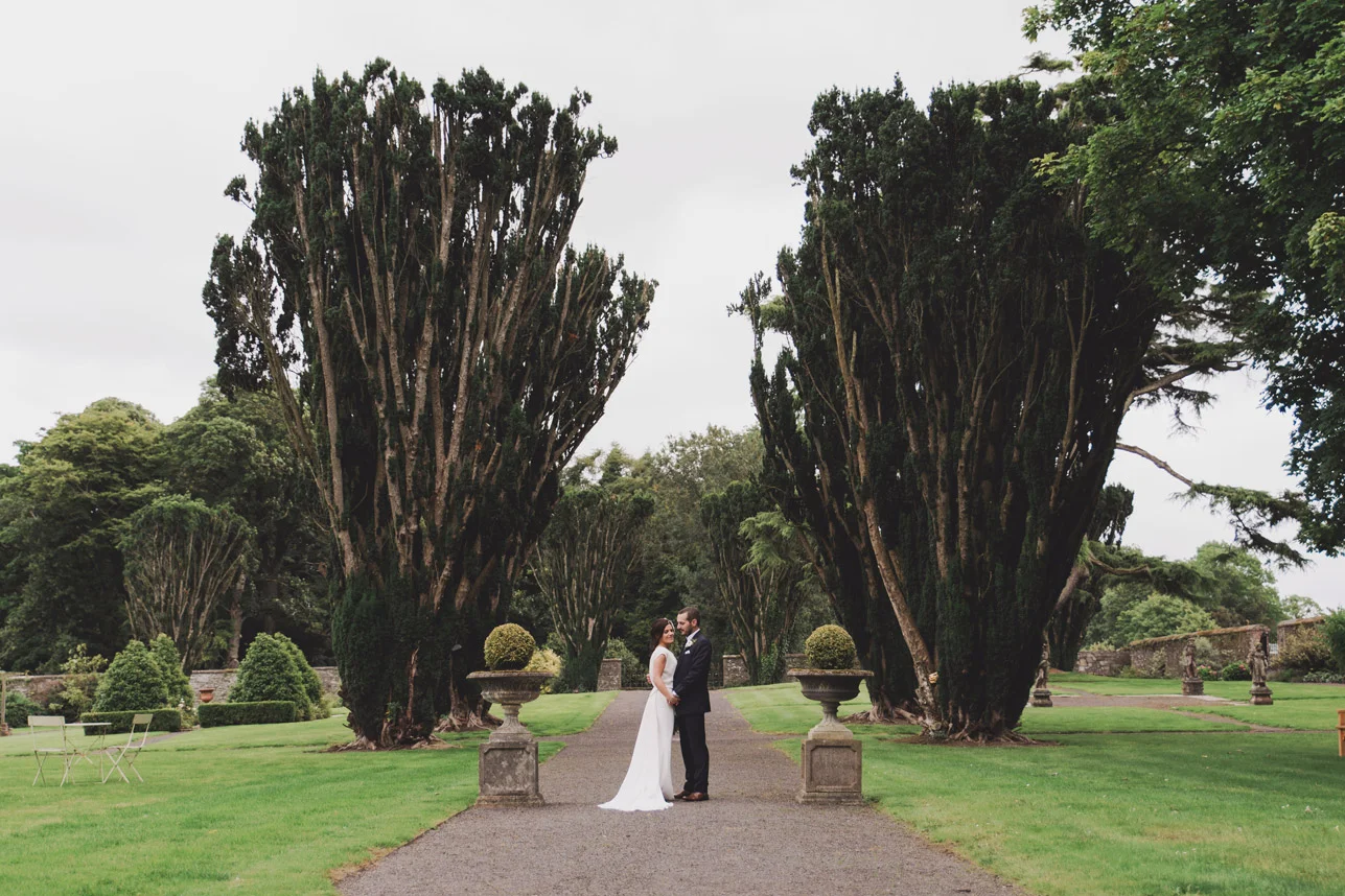 Bride and groom walking in Tankardstown House Gardens Co Meath Wedding photography meath ireland