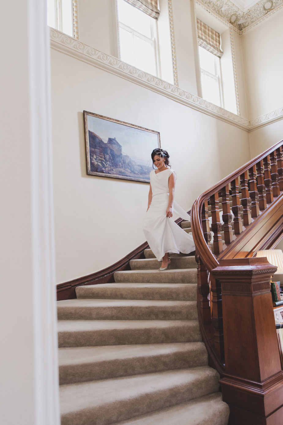 Bride coming down stairs in Tankardstown House Meath Wedding photographers meath ireland