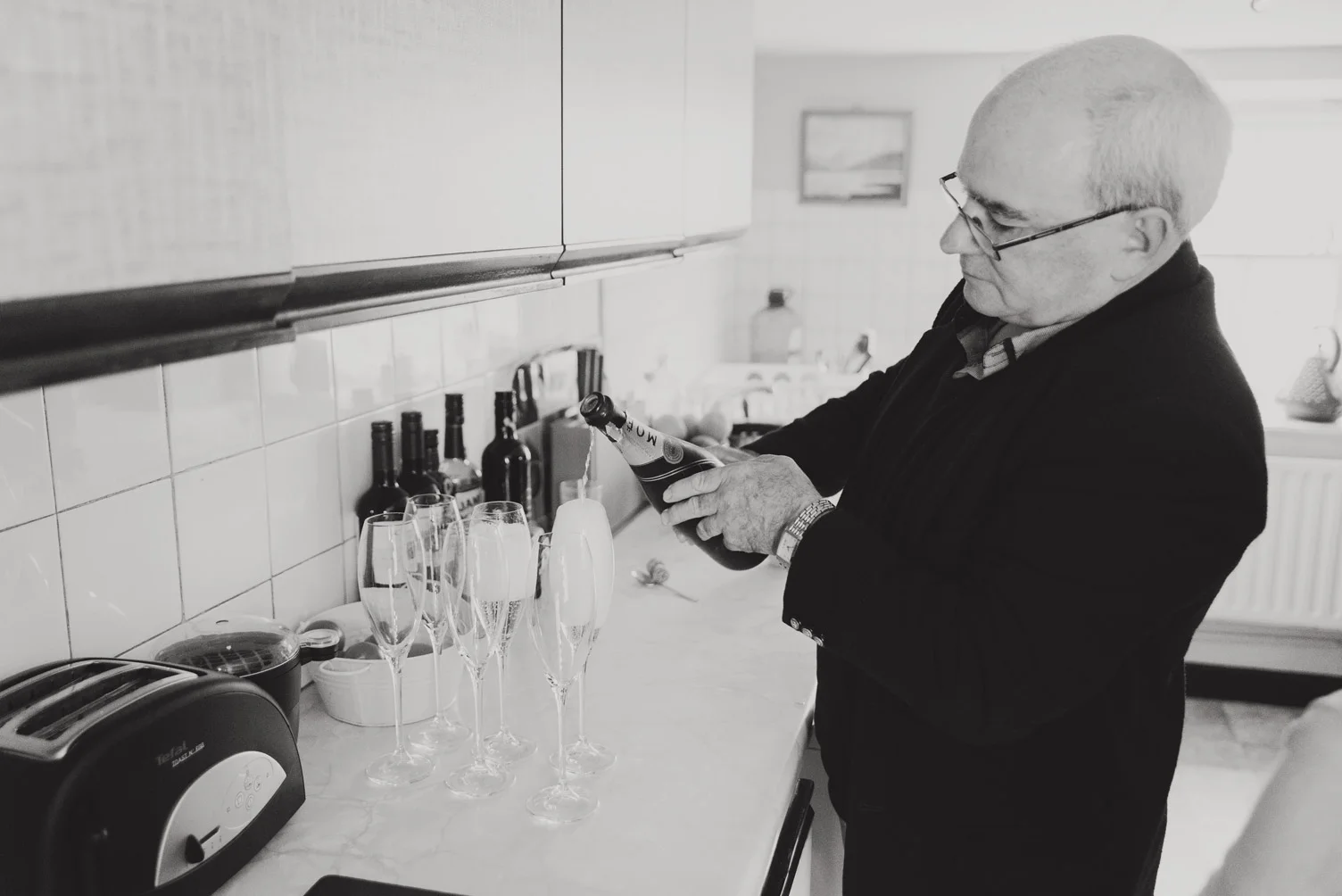 Father of the bride pouring champagne wedding photography meath