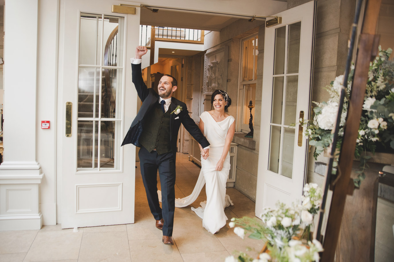 Bride and groom entering dining room in Tankardstown House Meath Wedding photographers meath ireland