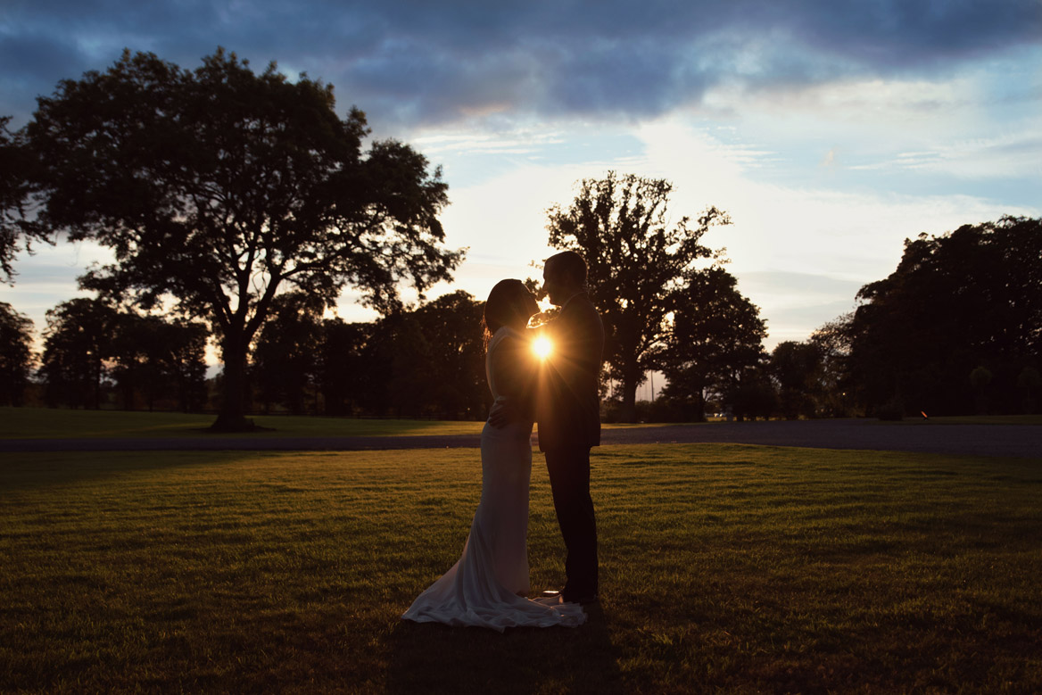 Bride and groom at sunset in Tankardstown House Meath Wedding photographers meath ireland