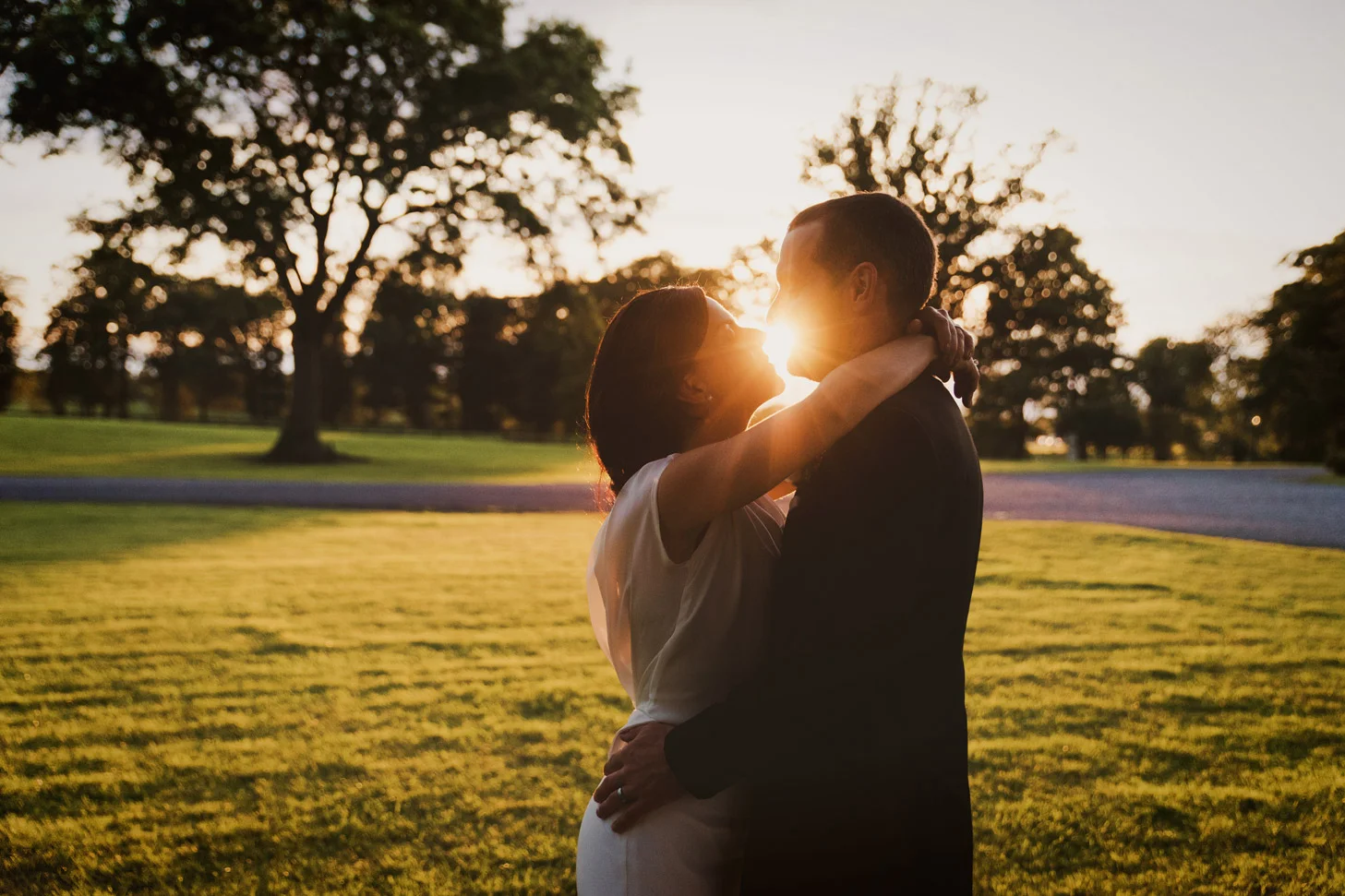 Bride and groom kissing at sunset in Tankardstown House Meath Wedding photographers meath ireland