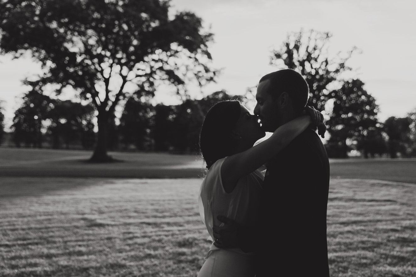 Bride and groom kissing at sunset in black and white at Tankardstown House Meath Wedding photographers meath ireland