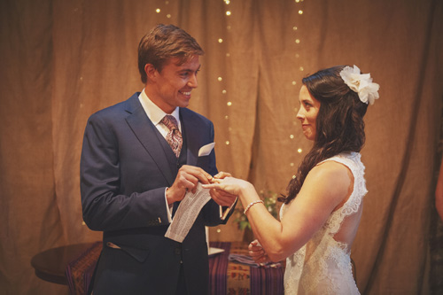 borris house wedding photography groom putting ring on bride's finger