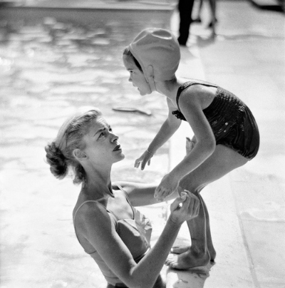 Lauren Bacall at the pool with her daughter. Photographed by Phil Stern