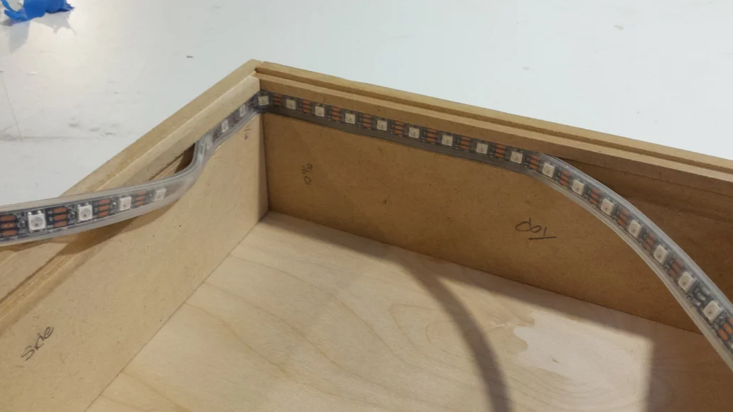Installing the Adafruit Neopixels that will create the sunrise and sunset effect in the shadow Box