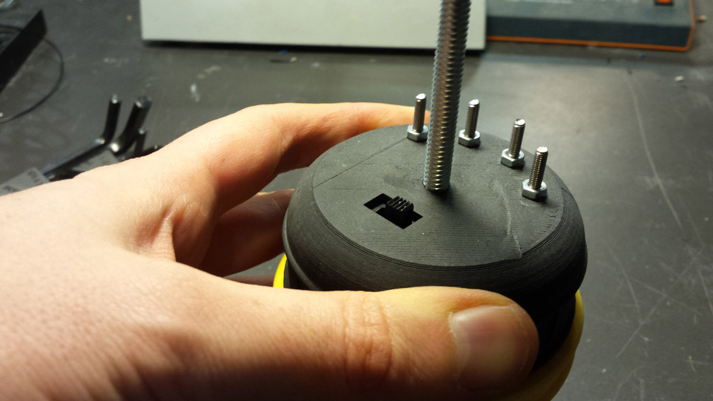 The 1/4-20 threaded screw is the common negative terminal for the batteries. 
