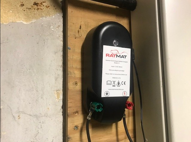 The RatMat energiser fitted on the wall to keep it safe