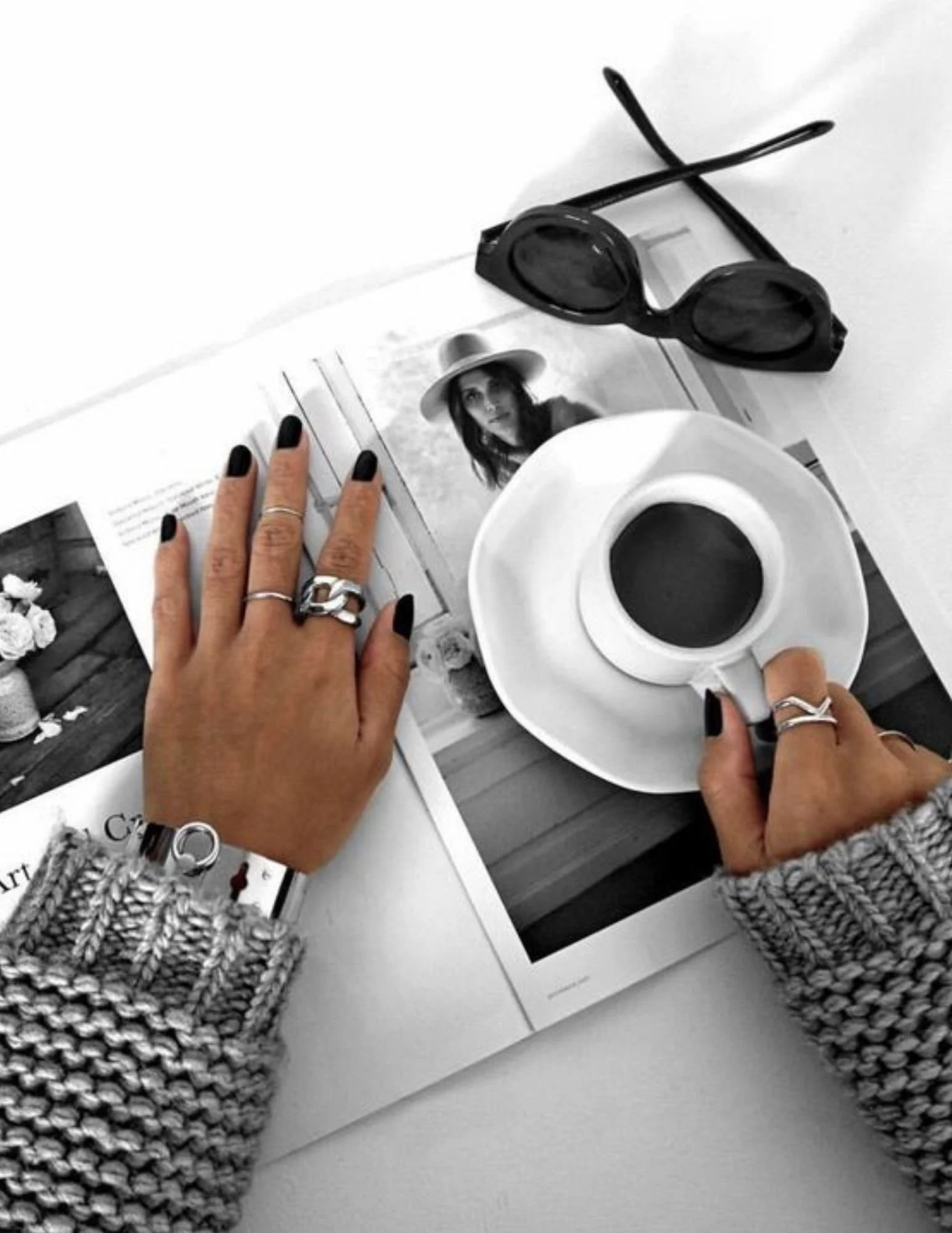 Short rounded black nails with a smooth glossy finish