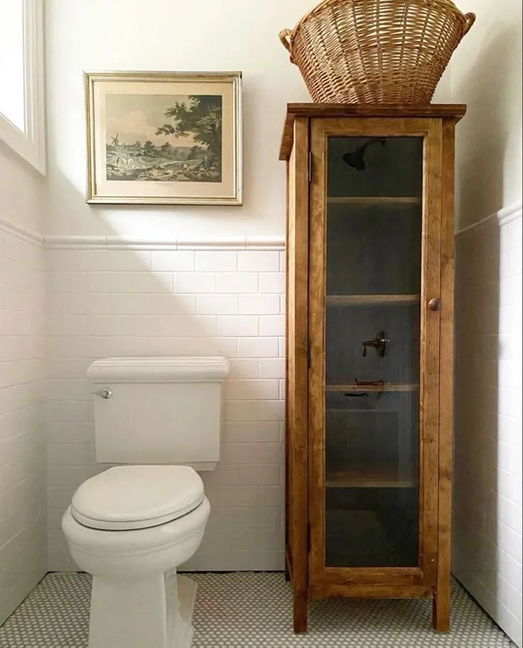 antique cupboard cottage bathroom storage idea