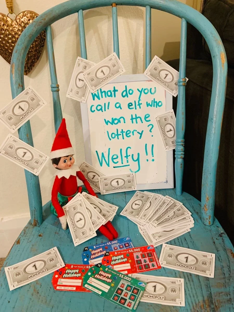 Elf on the Shelf holding lottery scratch-off tickets
