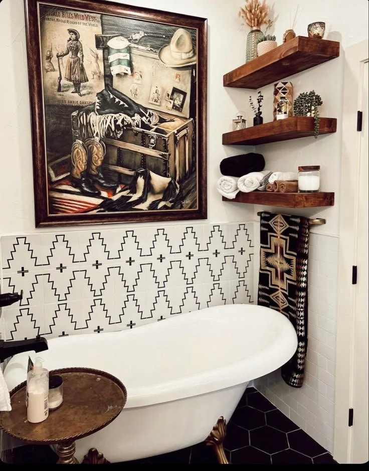 Aztec-pattern tile wainscot behind a clawfoot tub