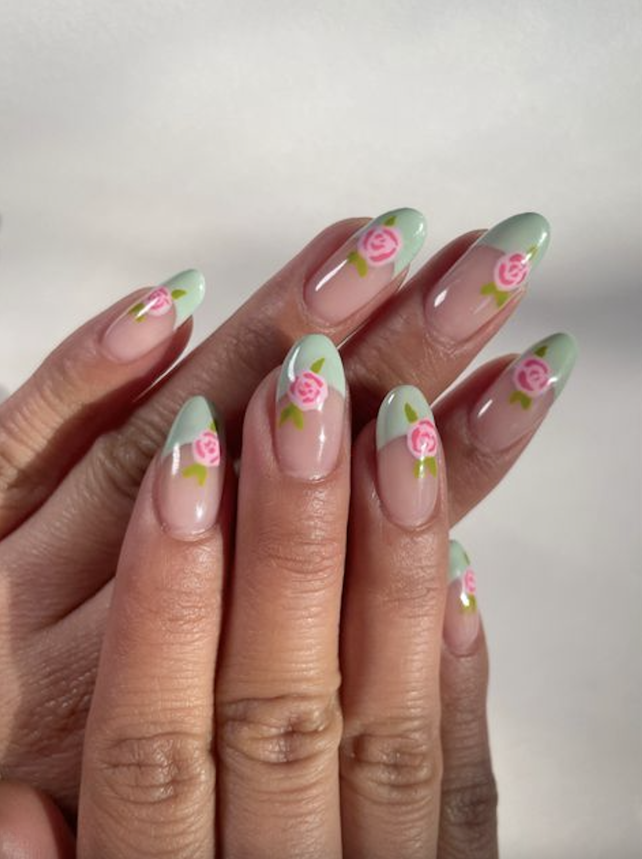 sage french manicure with roses