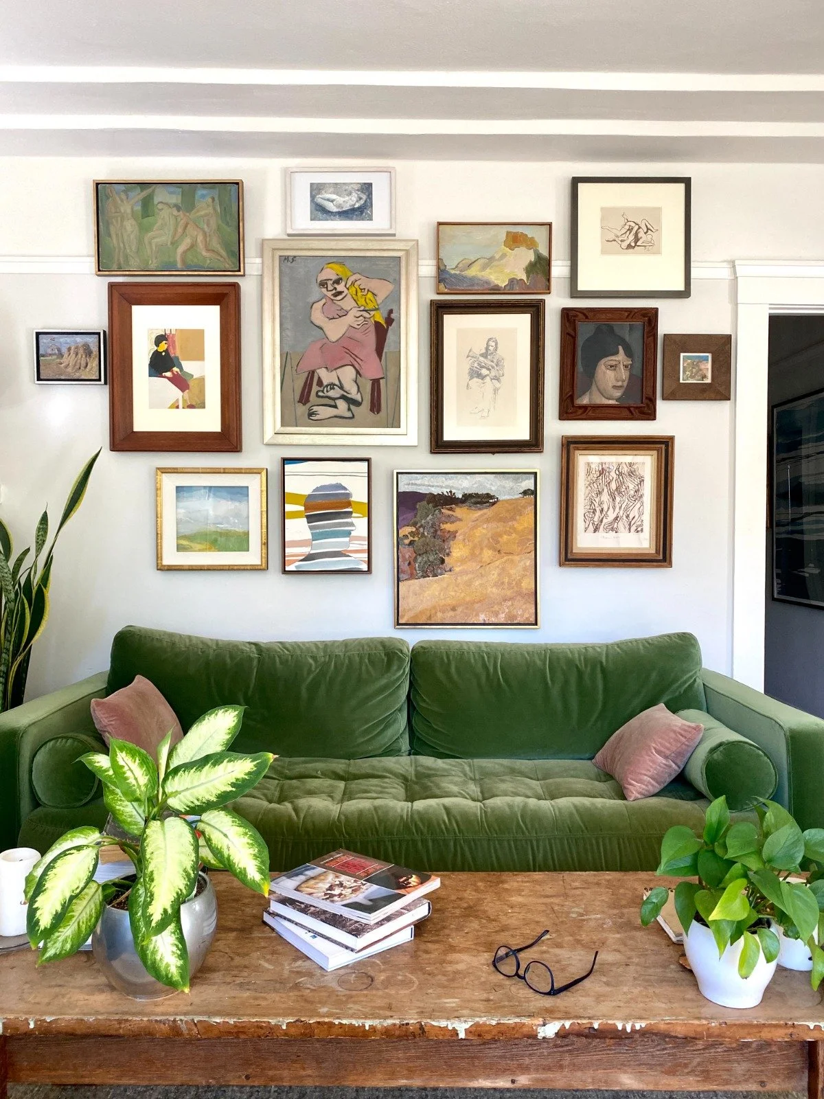 green sofa art wall with plants