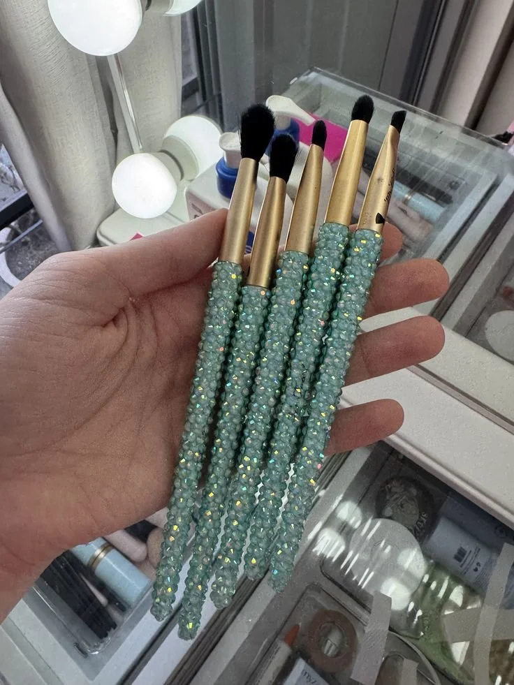 bedazzled makeup brushes.