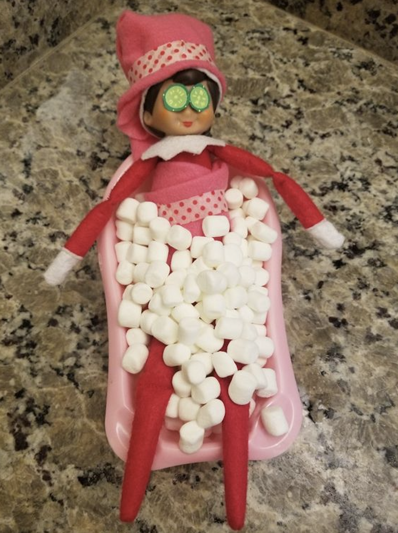 Elf on the Shelf taking a bubble bath in mini marshmallows