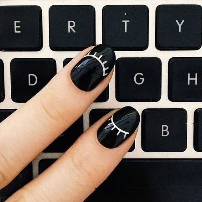 Black nails with white eyelash line art details