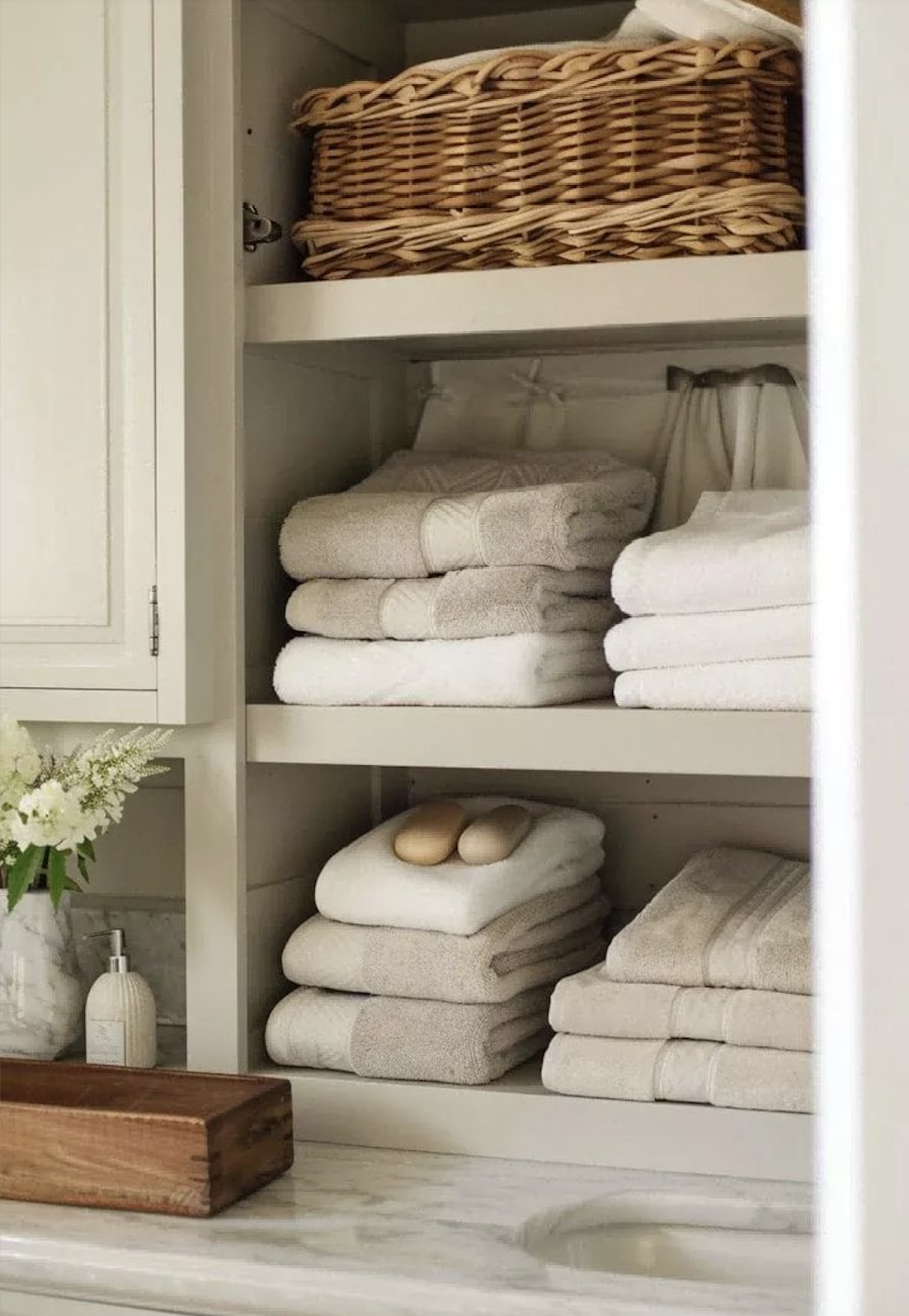 woven baskets neutral towels cottage bathroom storage