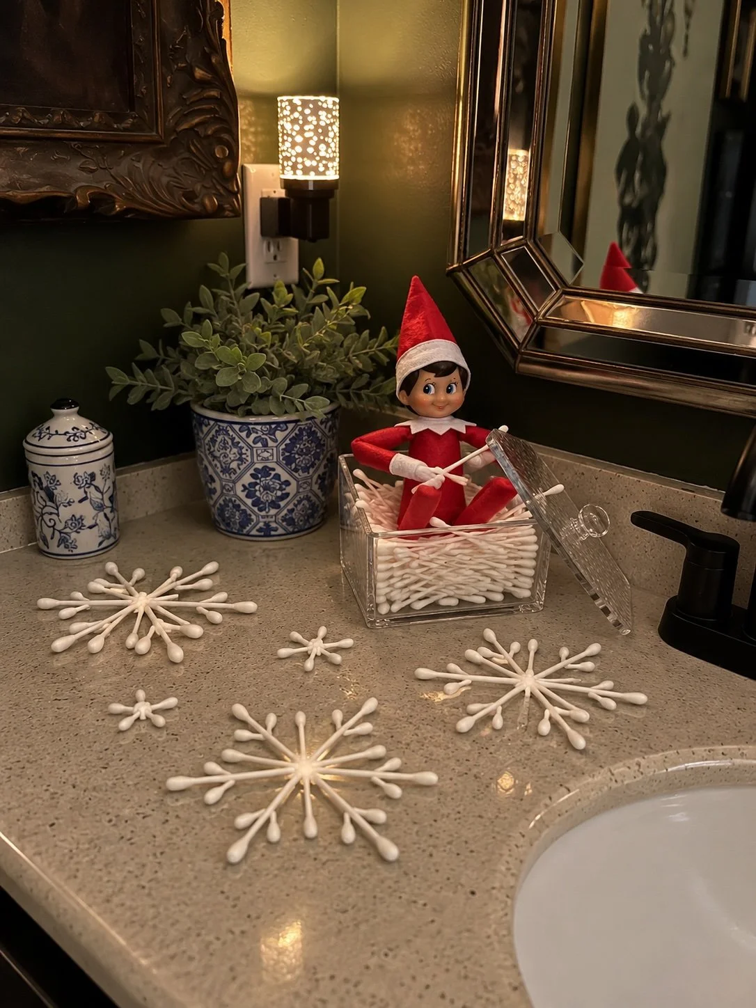 Elf on the Shelf with snowflakes made from Q-tips