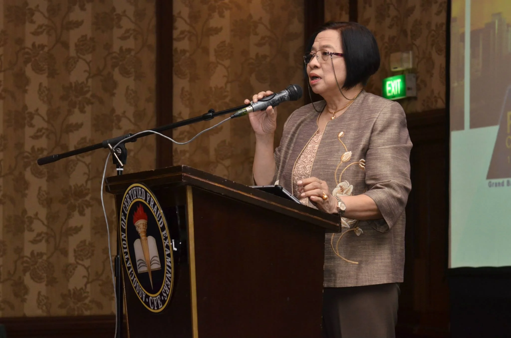 Chair of the Chapter Board of Trustees, Lilian S. Linsangan CFE-Retired, CIA, addresses the crowd.