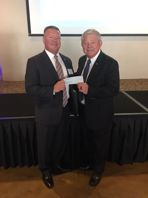 Heartland Chapter Director Rick Belik, presenting their scholarship donation to ACFE President Jim Ratley.
