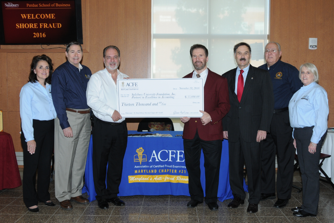 Maryland ACFE Chapter Leaders presenting check to Dr. Ken Smith, Salisbury University