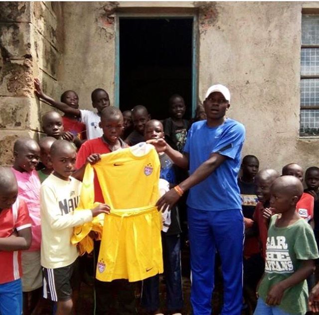 Coach Davis, Manyatta Slum&rsquo;s self-proclaimed &ldquo;Slum Father,&rdquo; and a vital asset to our partner program, Soccer Plus Outreach, showing off newly  donated soccer uniforms for the children we work with in Kisumu City, Kenya. We would lik