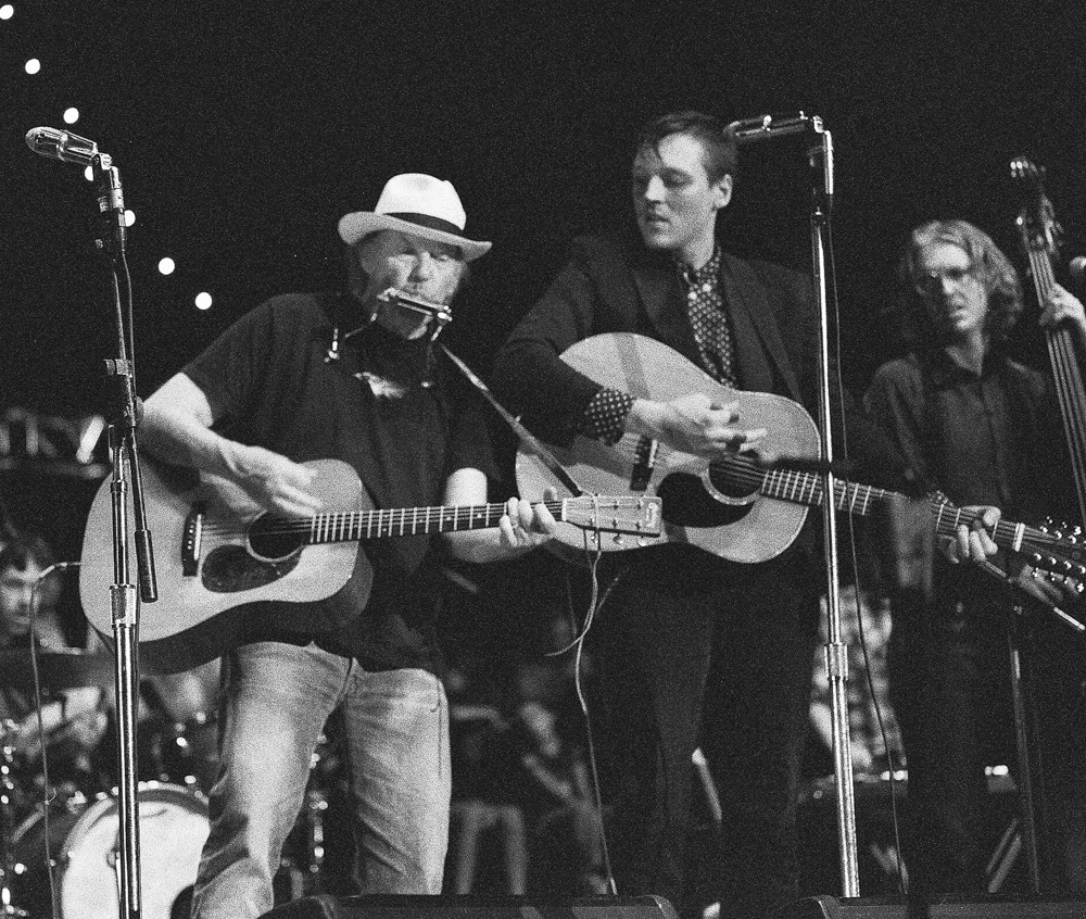 ⌃ Neil Young and Arcade Fire