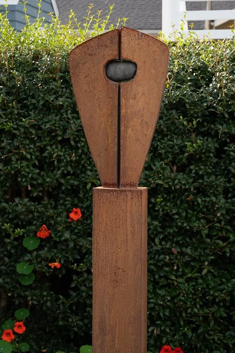 Between, a Rock - welded steel, rock by Dan Freeman