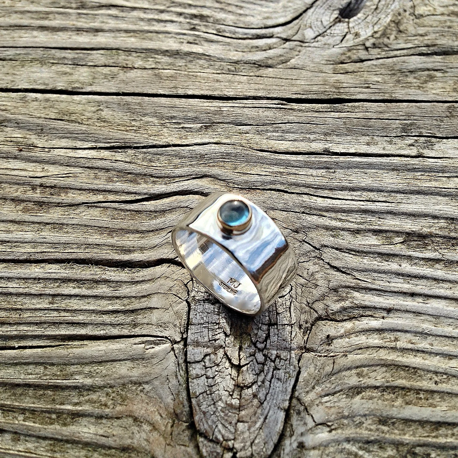 wide band w stone and gold bezel.jpg