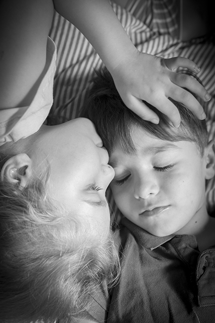 Photographing 3 kids under 6 the morning after halloween was challenging! But in between the chaos, this beautiful moment between twins happened. For all of about 2 seconds... but thats all you need for the perfect keepsake image! Captured at their home. 