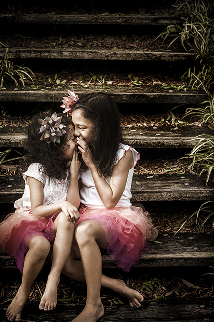 Being able to capture the magic of childhood is what got me into photography to begin with. Being able to act like a kid to encourage kids to get away from the "say cheese" that's been drummed into them. Photographed at their home, allows these two to feel comfortable and play games!