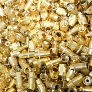 Image of batch of gold connectors, one form of electronic scrap contacts, pins and meltables Specialty Metals refines and recycles for precious metals.