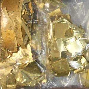 Photo of gold plated scrap, gold leaf and other gold alloy our customers have shipped to Specialty Metals for recycling and refining.