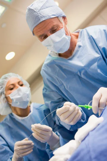 Physicians insert a platinum EP catheter into a blood vessel that leads to the patient’s heart.