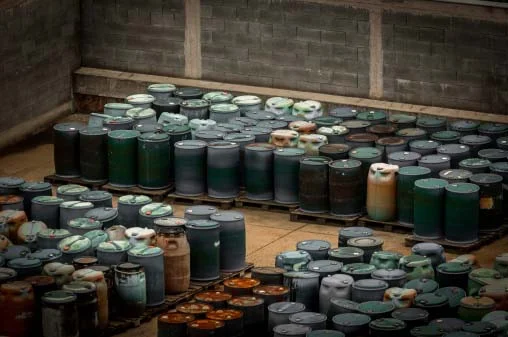 Photo of skids of drums filled used manufacturing fluids containing traces precious metals that can be recycled profitably by Specialty Metals.