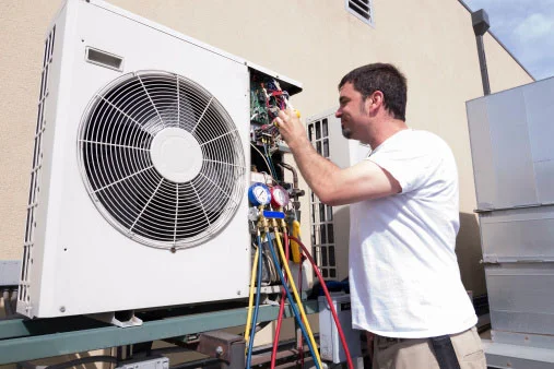 Photo of an air conditioning system being repaired. Systems like this contain gold-bearing circuit boards and platinum thermocouple wire which can be recycled profitably by Specialty Metals.