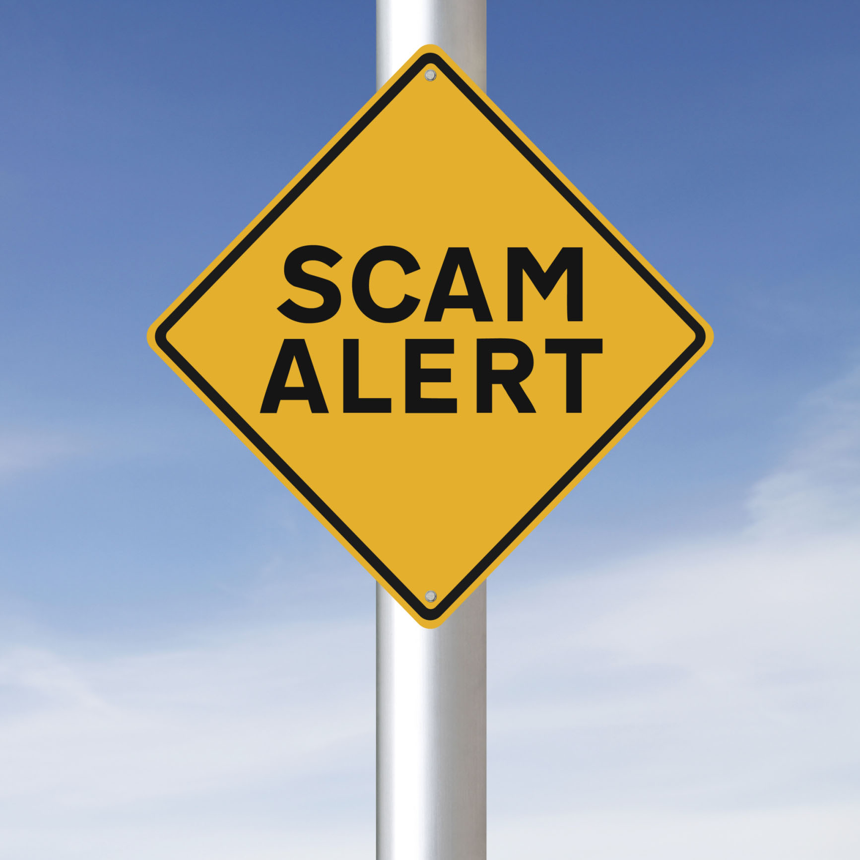 Photo of a scam alert sign, used for a blog post about avoiding precious metal scams by using a reputable recycler like Specialty Metals. Credit: amanalang/iStock/Thinkstock.